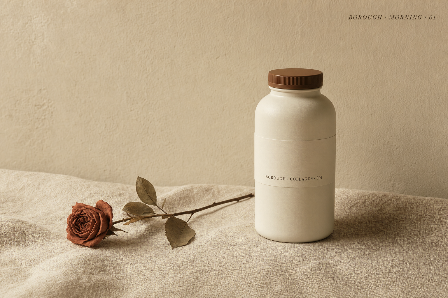 Hero — bottle beside dried botanical